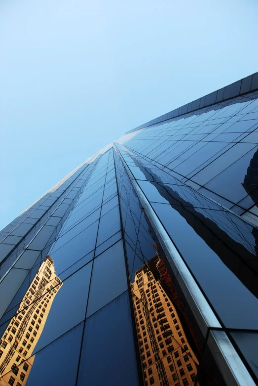 a view of the sky and building from bottom up