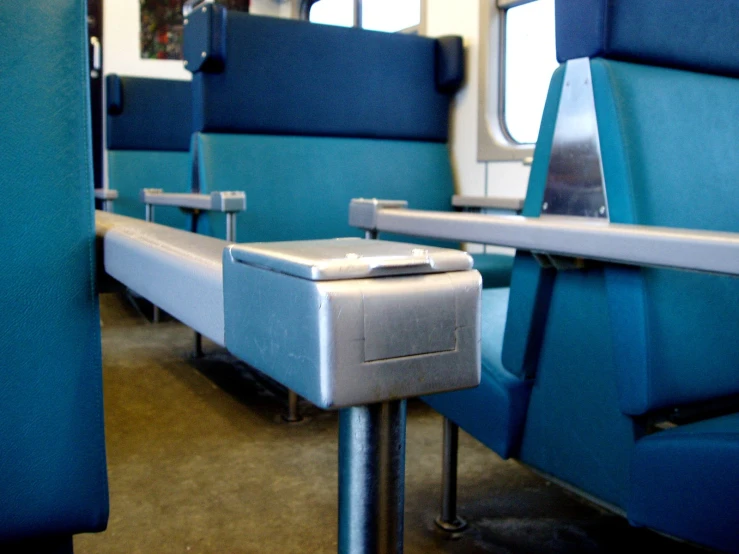 a bench sitting in the middle of a train