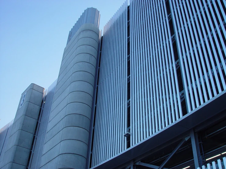 an abstract building, with two tall metal towers