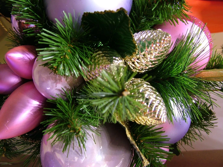 a closeup view of green, gold and purple ornaments