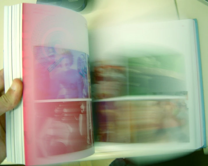 a book is open and blurred as it has blurry image in it