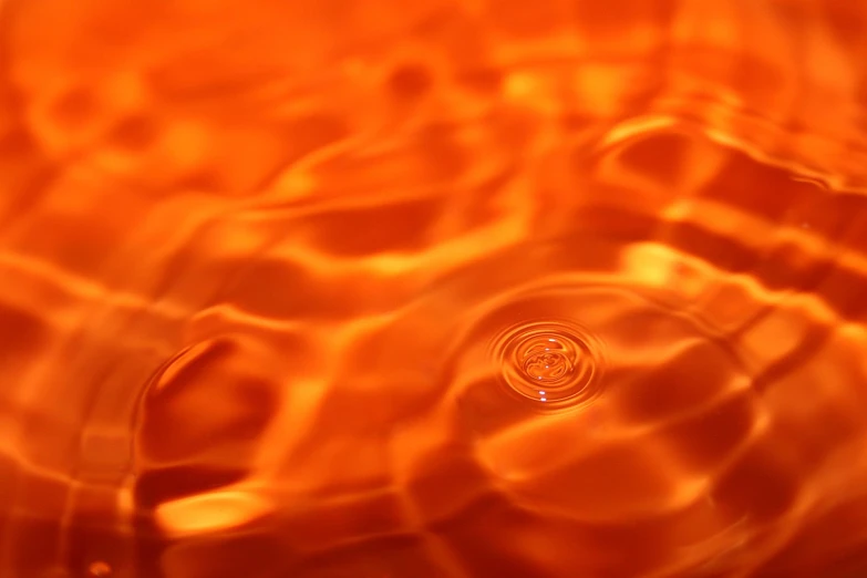 some water and a orange hued surface