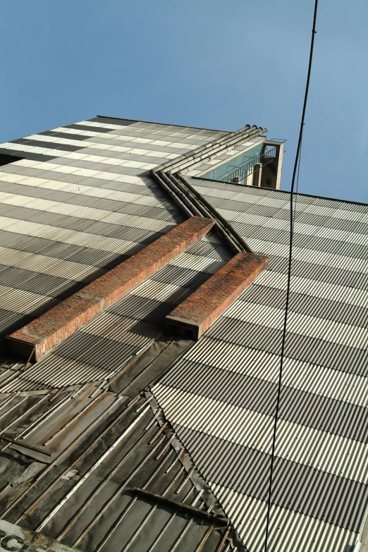 an upward view from the bottom of a building