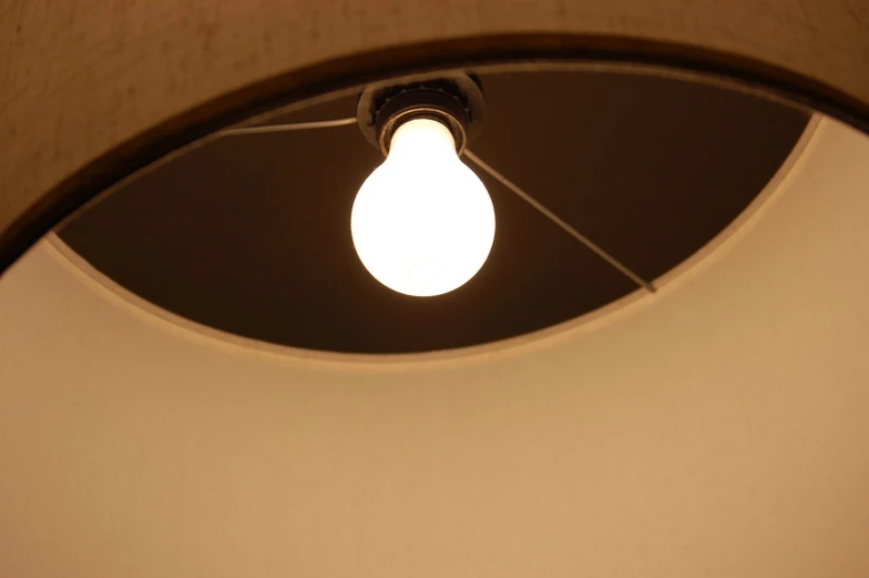 the light bulb is hanging from the ceiling