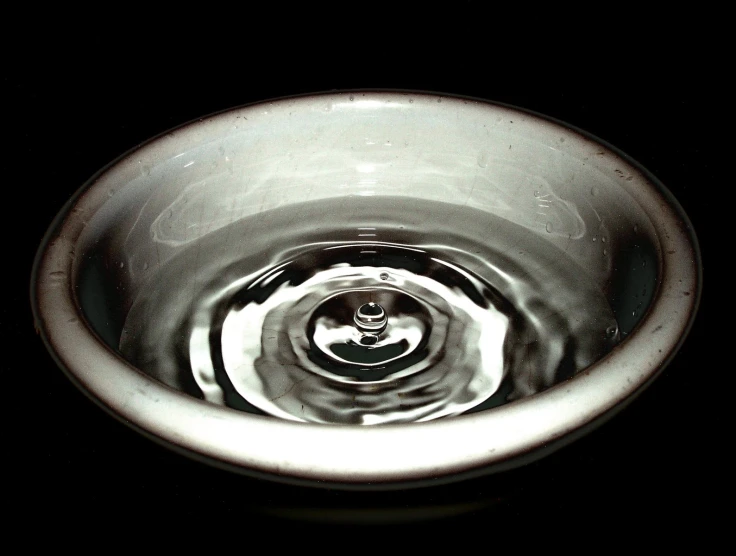 a silver sink with an image of a man on it