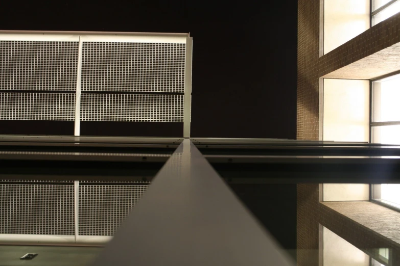 the view from inside a building, of the windows and metal bars