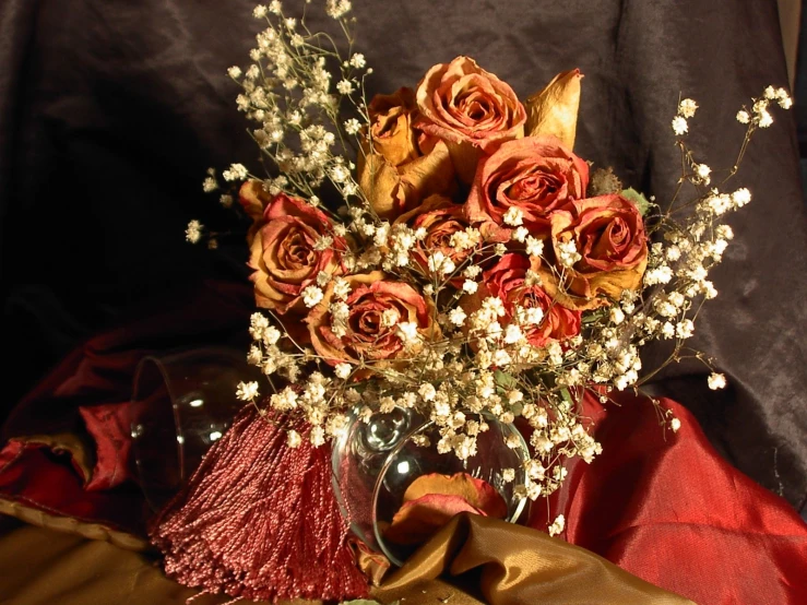 roses in vase with tassels and white baby's breath flowers