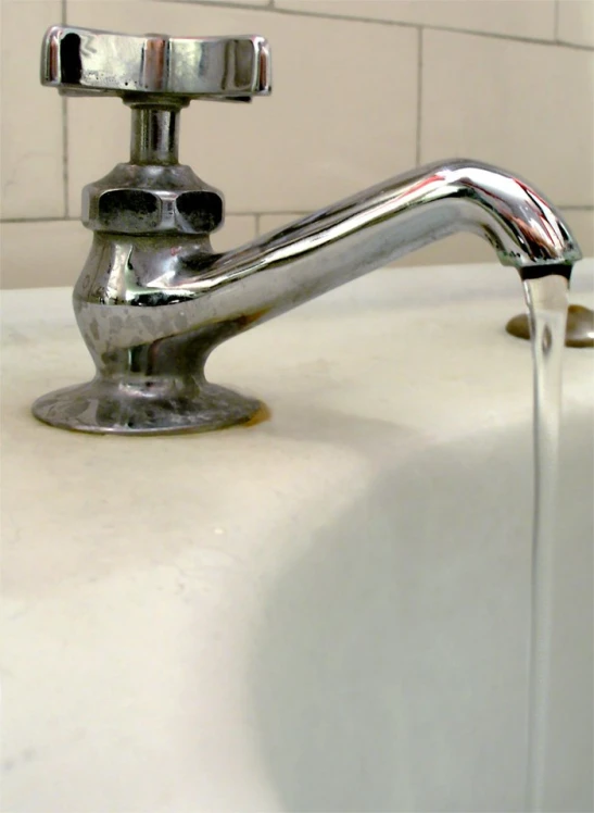 an image of a faucet running out of water