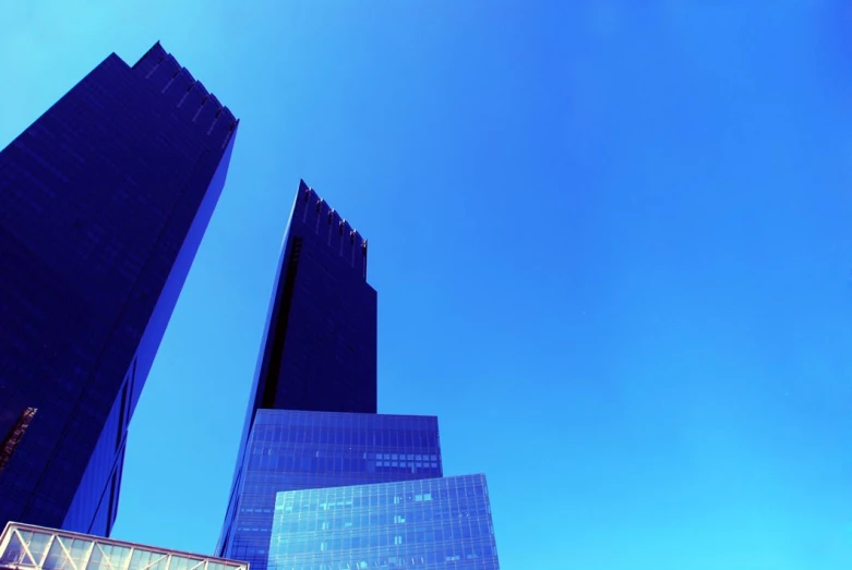 skyscrs line up against a clear blue sky