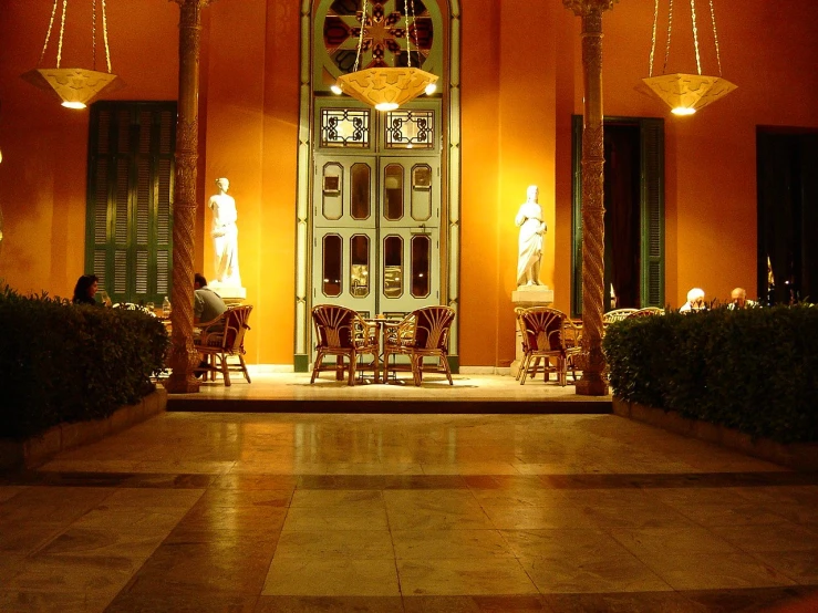 an entrance to a building decorated with chandeliers and decorations