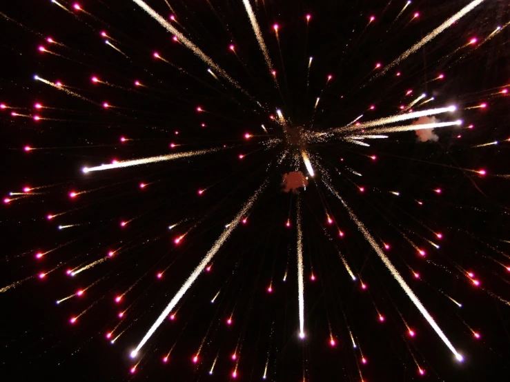 fireworks in the night sky as seen from below