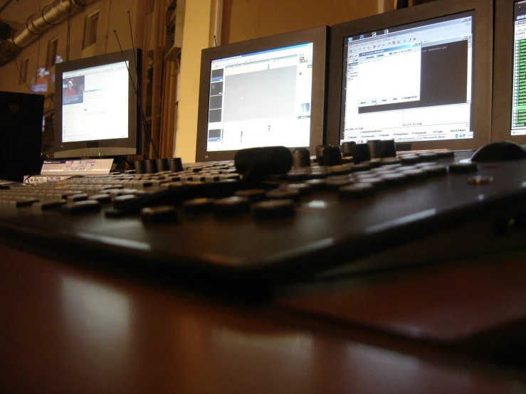 a table with several monitors showing a program on it