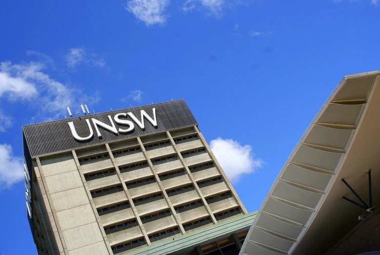 two large buildings with a clock on each of them