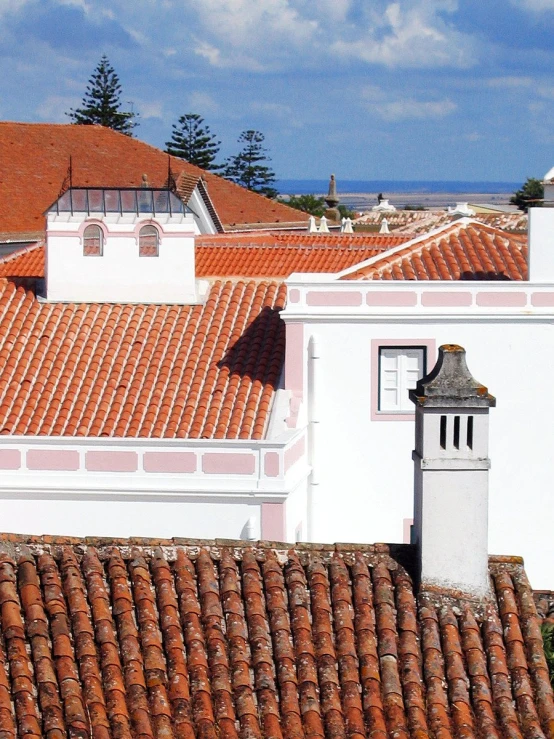 a large red bricked building with an old clock on top