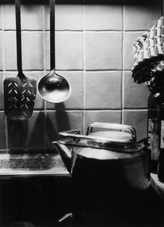 the pots are sitting on the stove in the kitchen