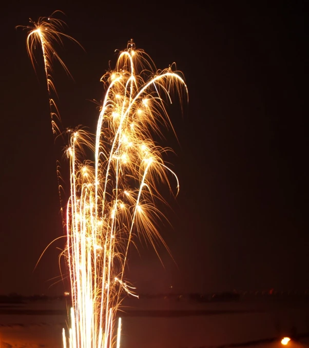 fireworks against a dark background lit up the sky