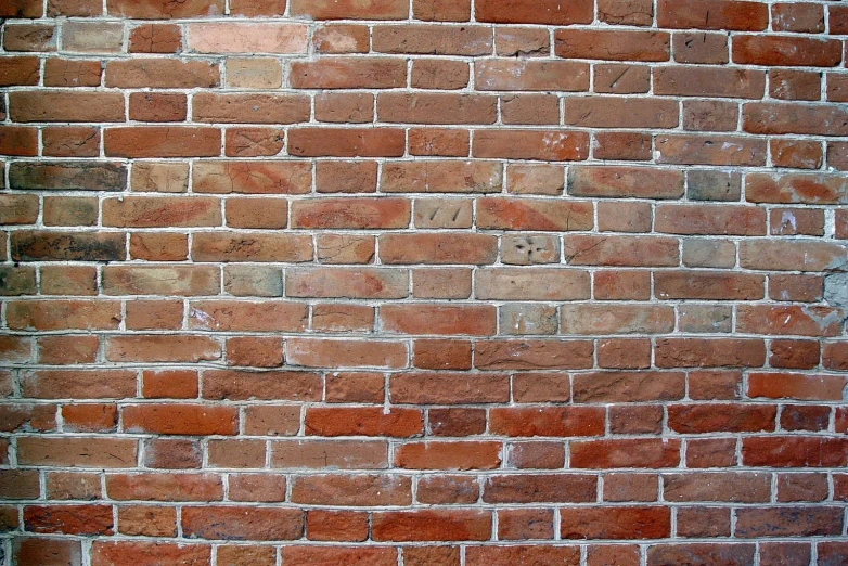 a po of a brick wall with the brick painted brown