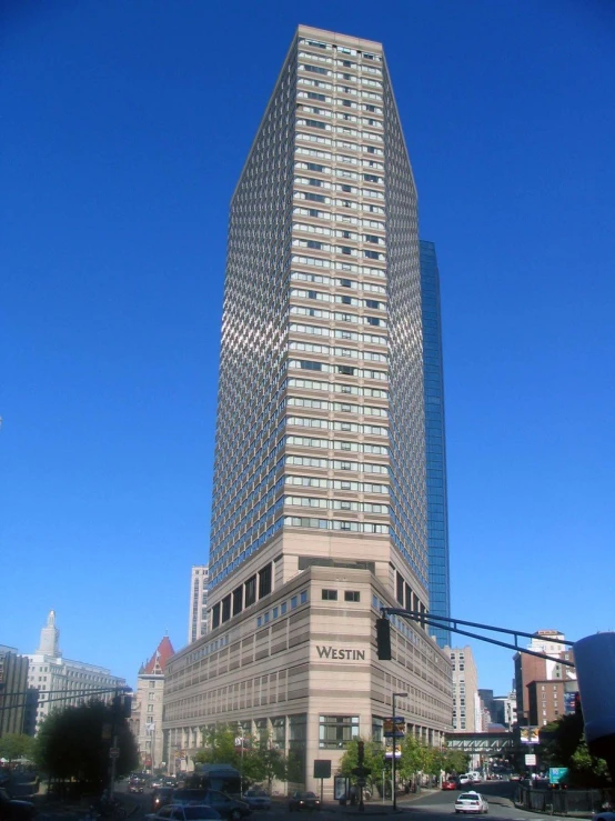 this tall building is by itself on the street