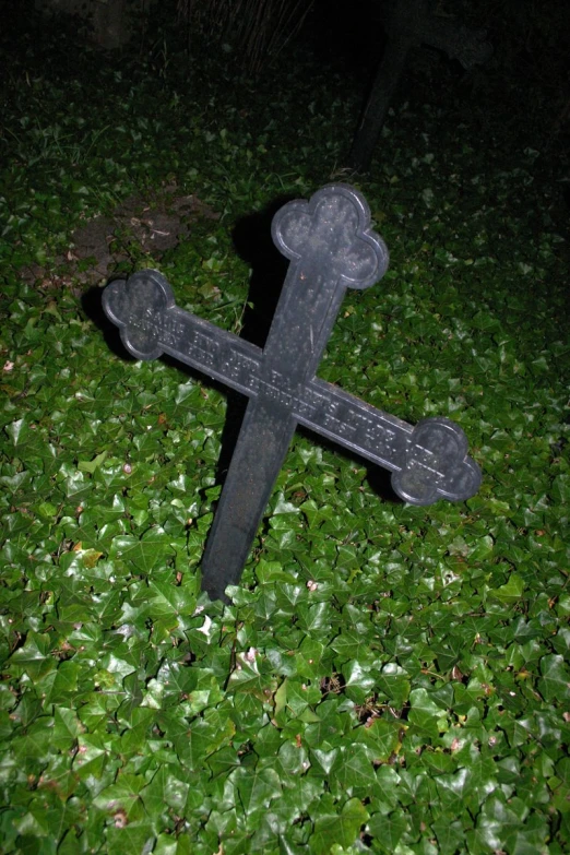 a large wooden sign sitting in the grass