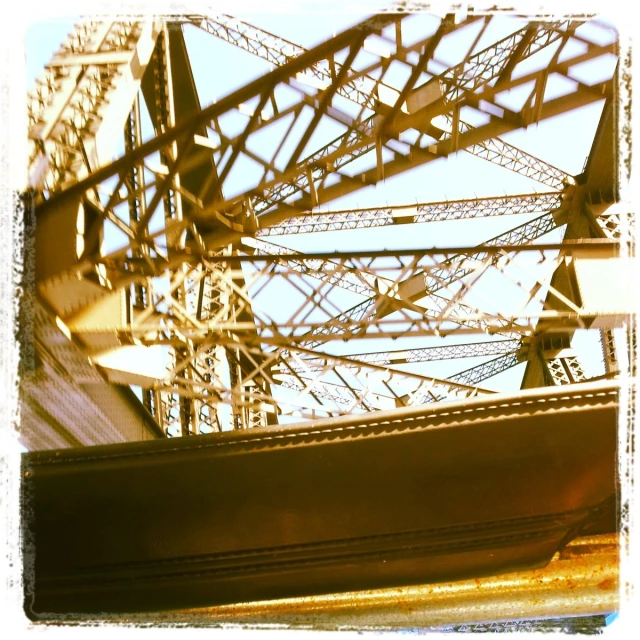 the top of an ornate metal structure with lots of wires