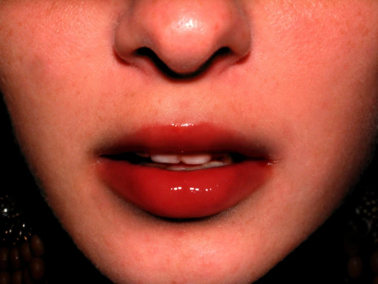 a person with red lips has their nose open