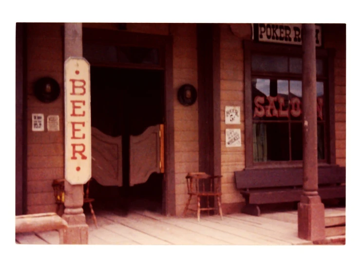 the front door to a building showing an advertit for bed linen