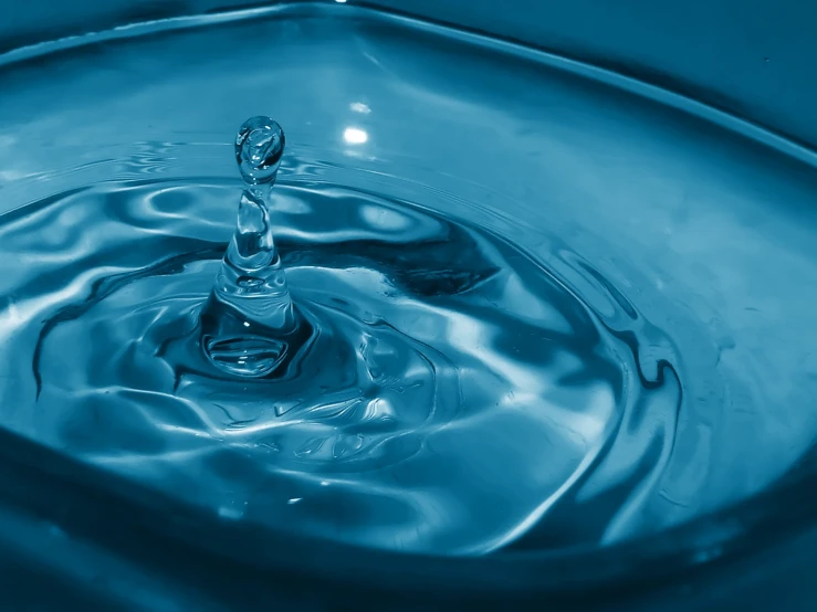 a blue swirl of water making a liquid