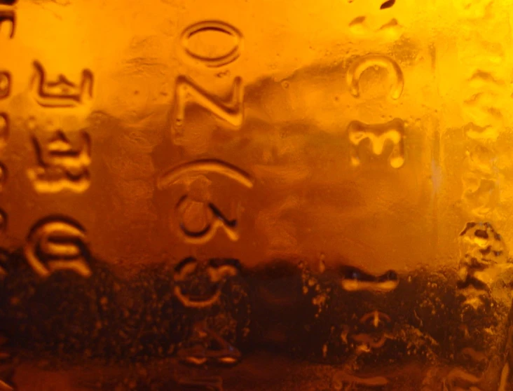 a close up image of a brown liquid bottle