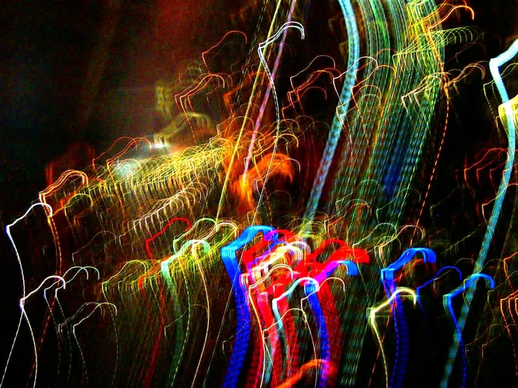 a blurry po of street lights with red, yellow and green colors