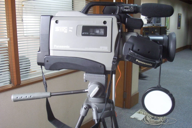 a tripod with some head phones sitting on it