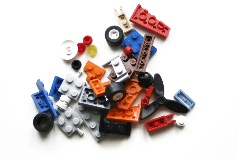 various lego pieces with one missing on a white background