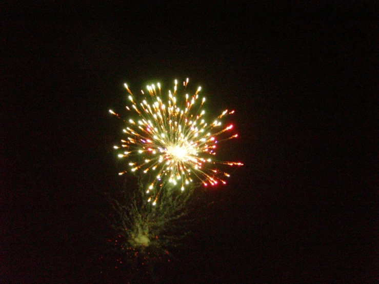 the fireworks is shining bright against a black background