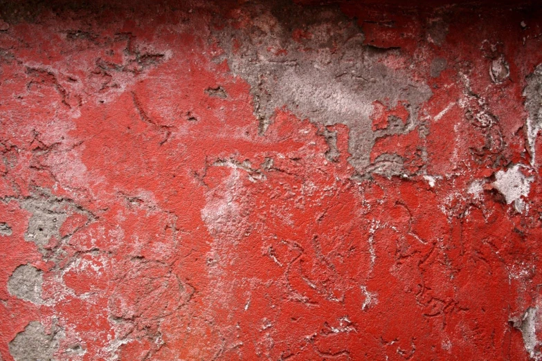 a wall is very worn and colorful with no painting