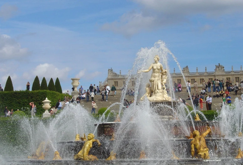 the fountains have a sculpture of a person in front