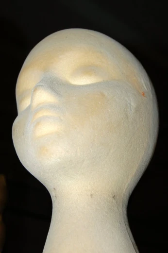the white marble head is on display with eyes open