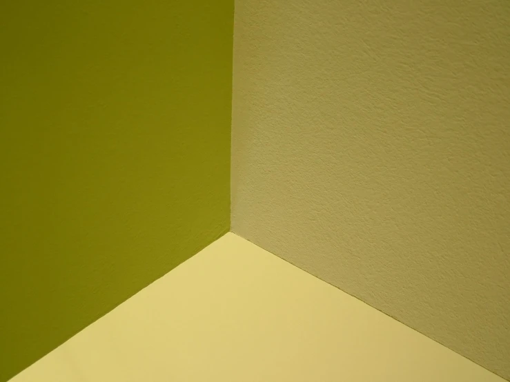 an angled image of a green and yellow wall