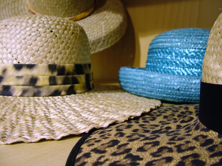 hats are piled on top of each other