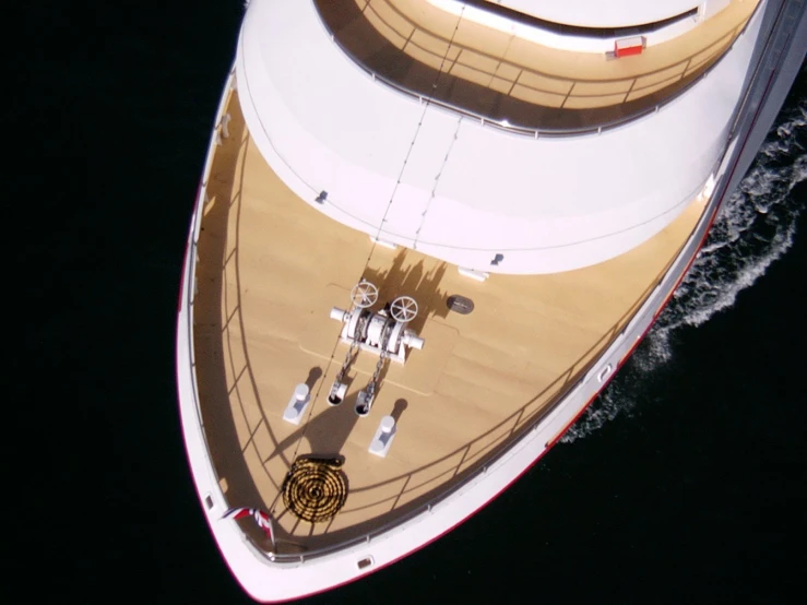 a white boat sailing through a body of water