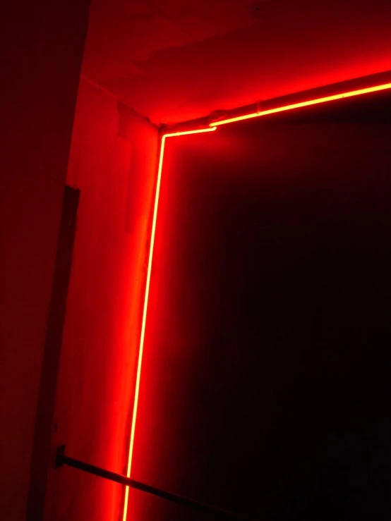 a red room is light up and has the corner cut off