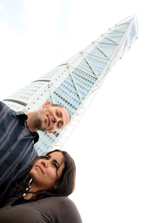 the woman and man are staring at the sky