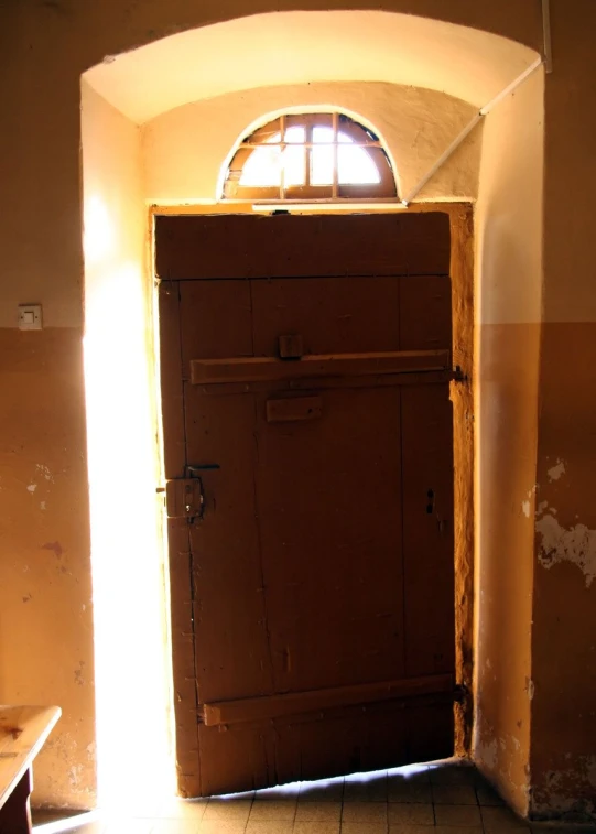 small open window in a narrow room with shutters