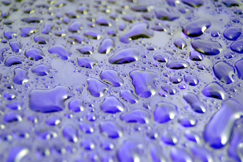 an oil or water texture is shown with drops