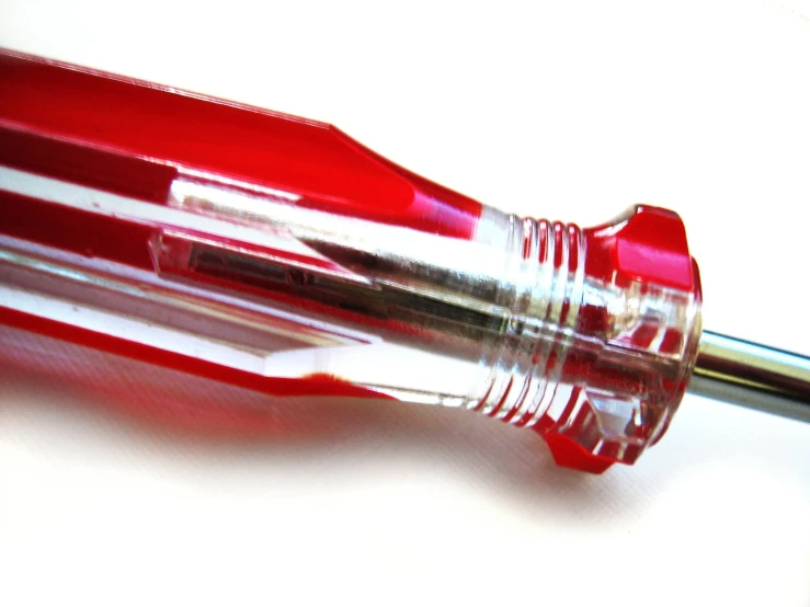 a very nice red pen with some writing on it