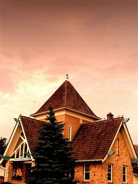 a large house with a tree in front