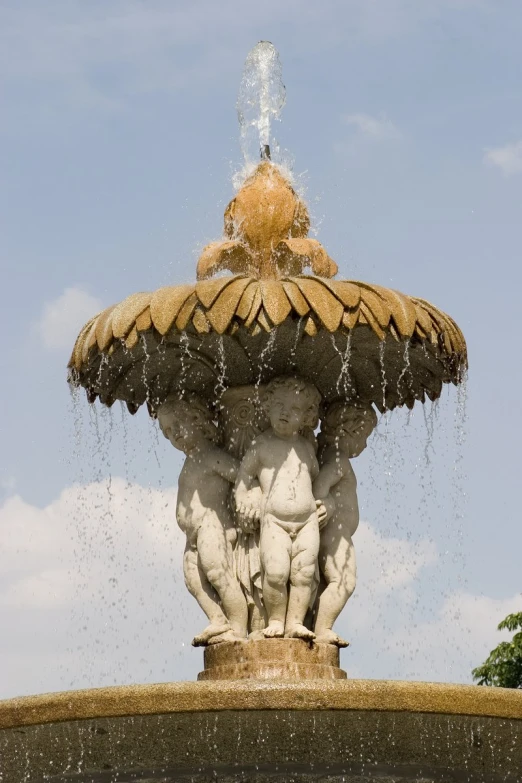 the fountain has a large water spout in it