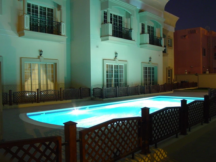 an illuminated pool in the middle of a walkway