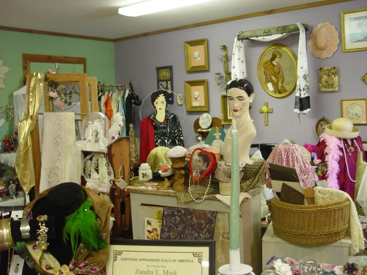 a room full of many mannequins and items
