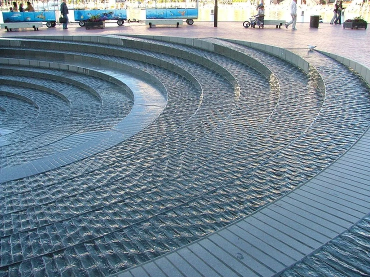 an underground tunnel with curved steps next to it