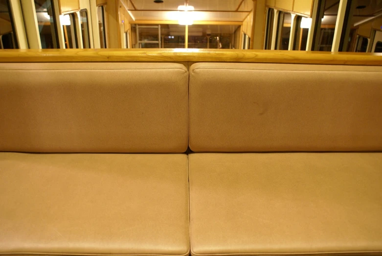 a view of a large coach couch in a train