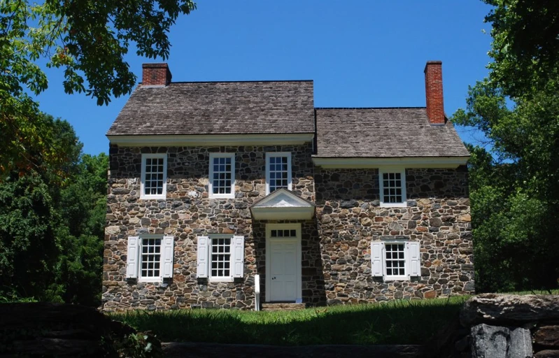 an old stone house in a country setting